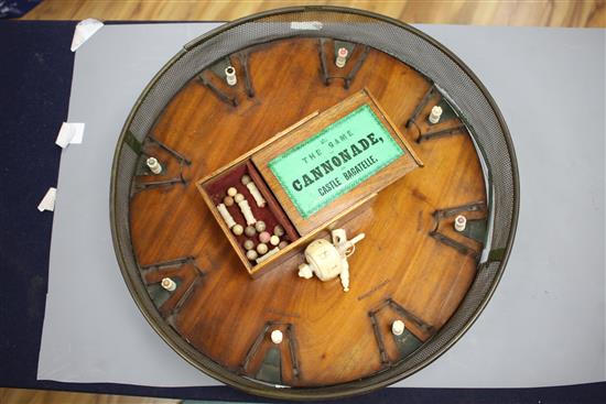 A rare mid 19th century Jaques of London Game of Cannonade of Castle Bagatelle, comprising a circular mahogany board, 38cms diameter,